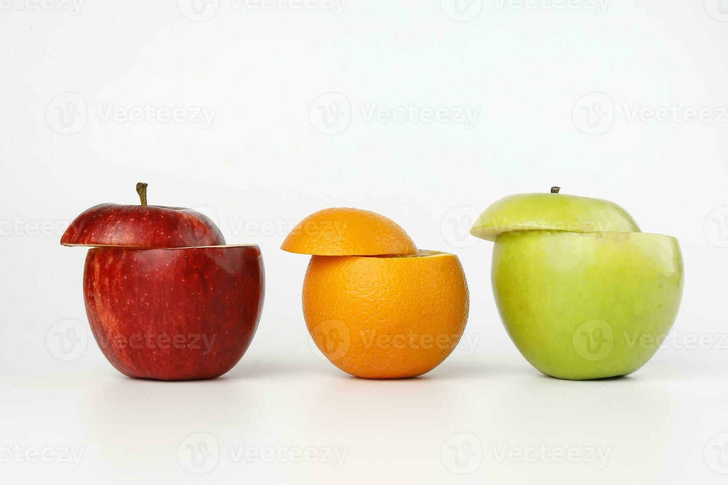 Healthy Red Green Cut Apple Orange juice drink idea concept on white background photo