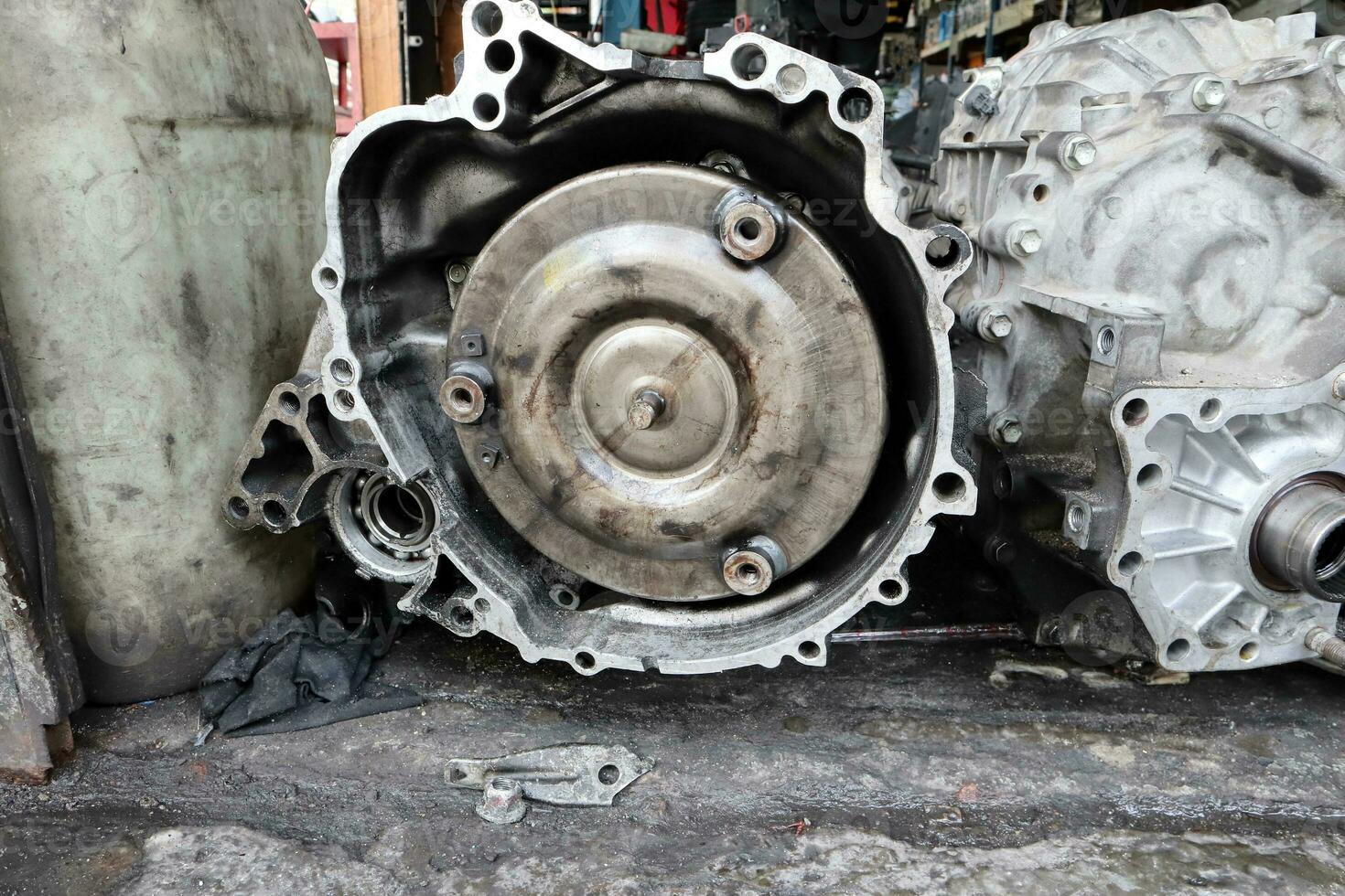Old dirty used broken Auto transmission gearbox on floor for