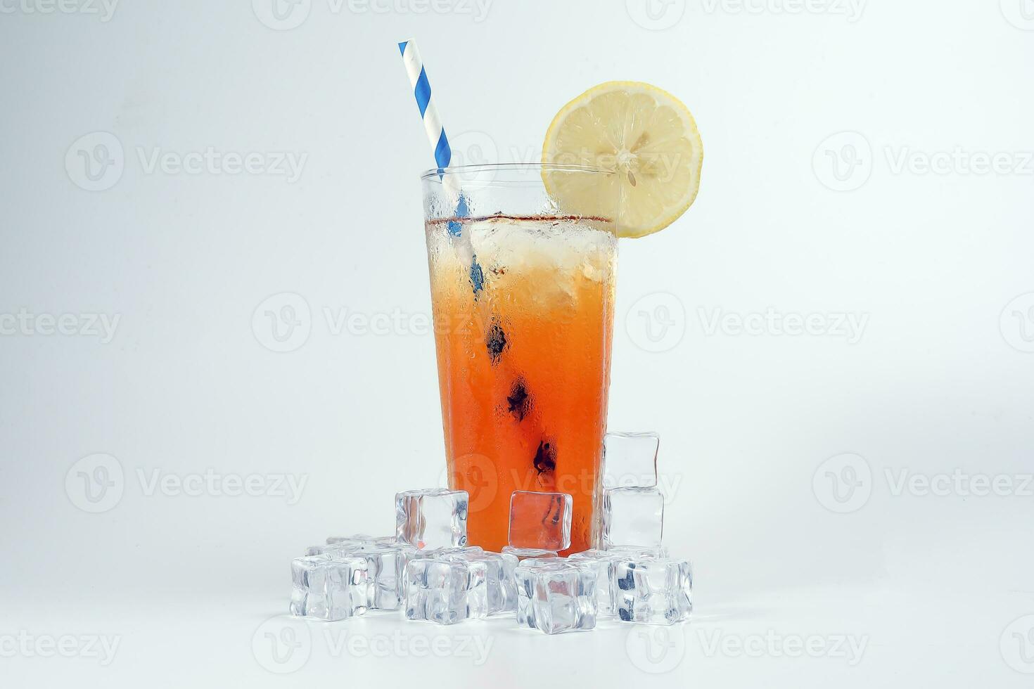 Ice lemon tea with ice cube yellow lemon slice blue white paper straw on white background photo