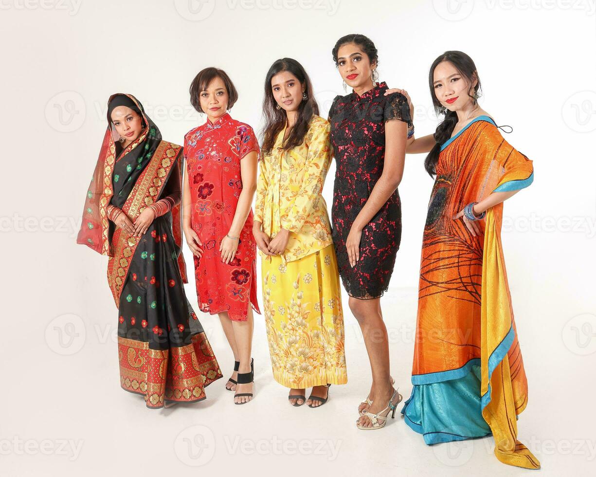 South east Asian Malay Chinese Indian race ethnic origin woman wearing dress costume baju kurung cheongsam samfu kebaya Sharee multiracial community on white background photo