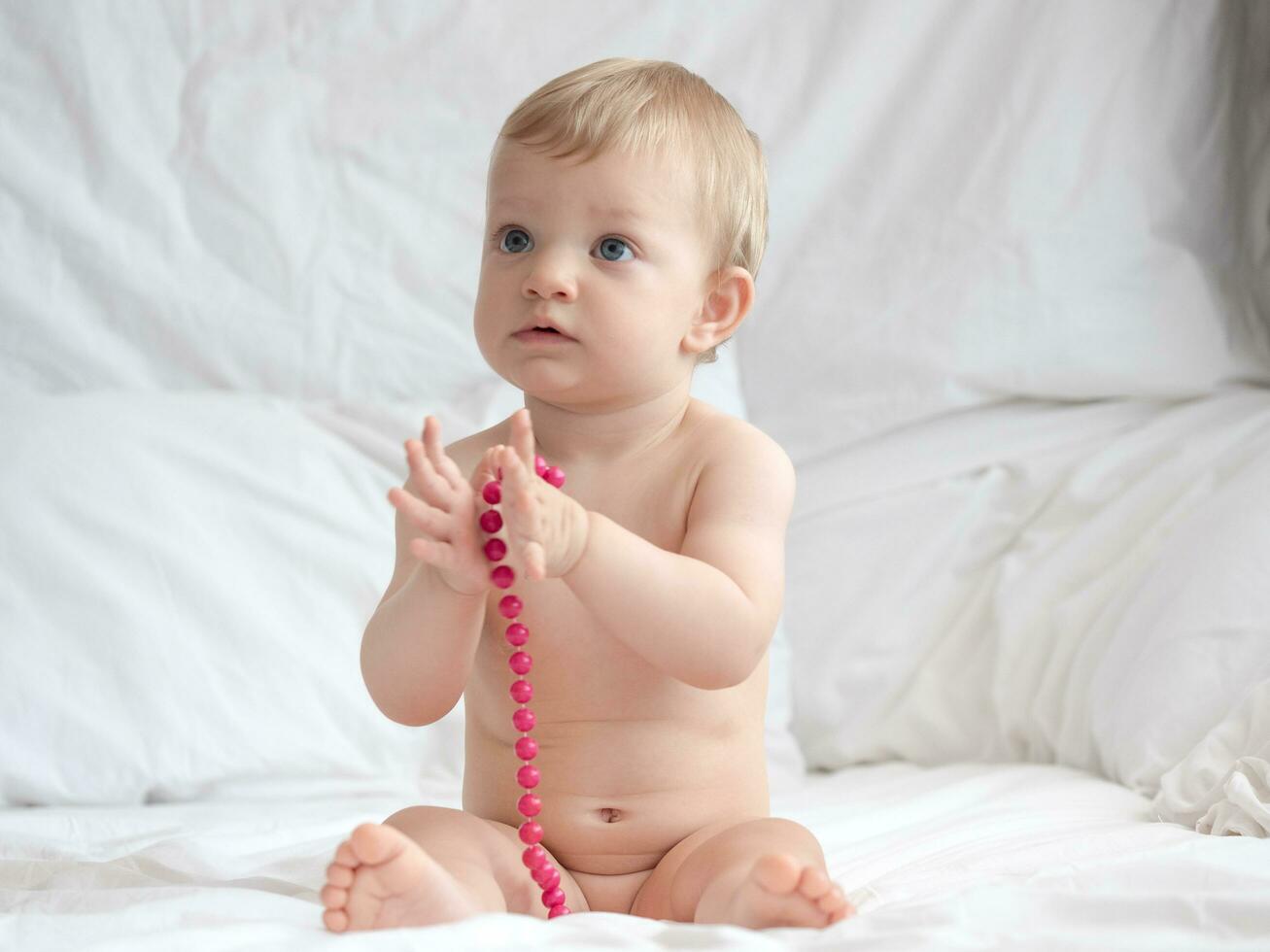 Baby on the bed photo