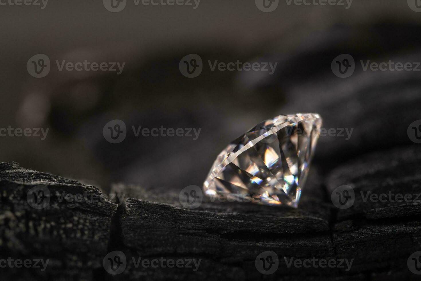 Diamond Gemstone on Black Coal photo