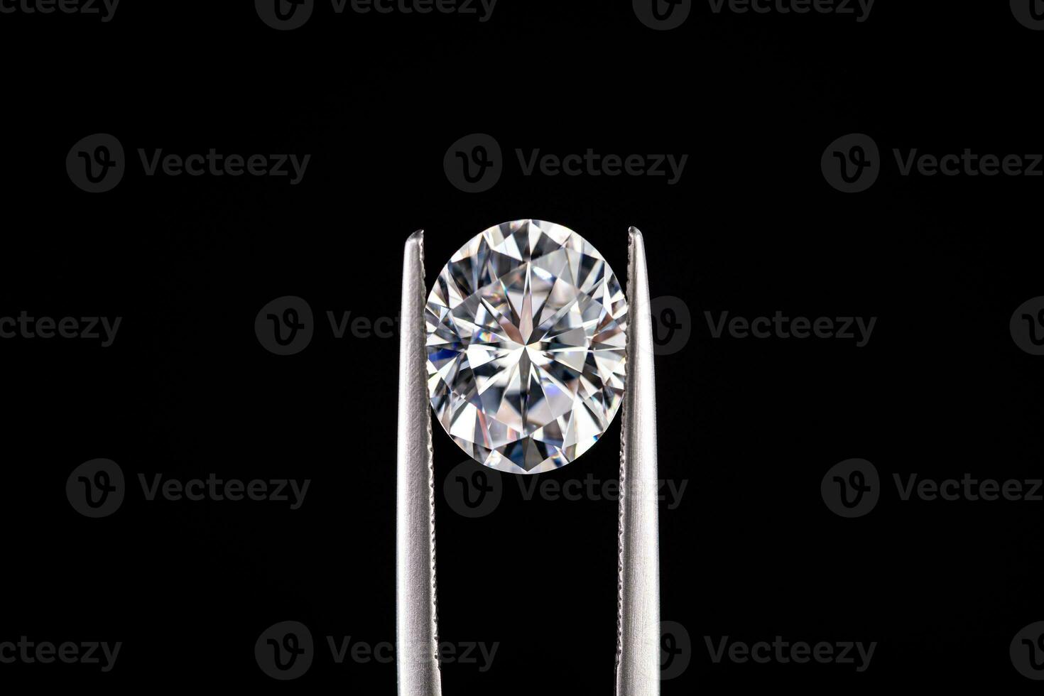 Diamond Gemstone in Jewelry Tweezers photo