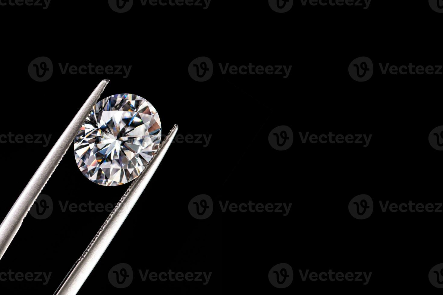 Diamond Gemstone in Jewelry Tweezers photo