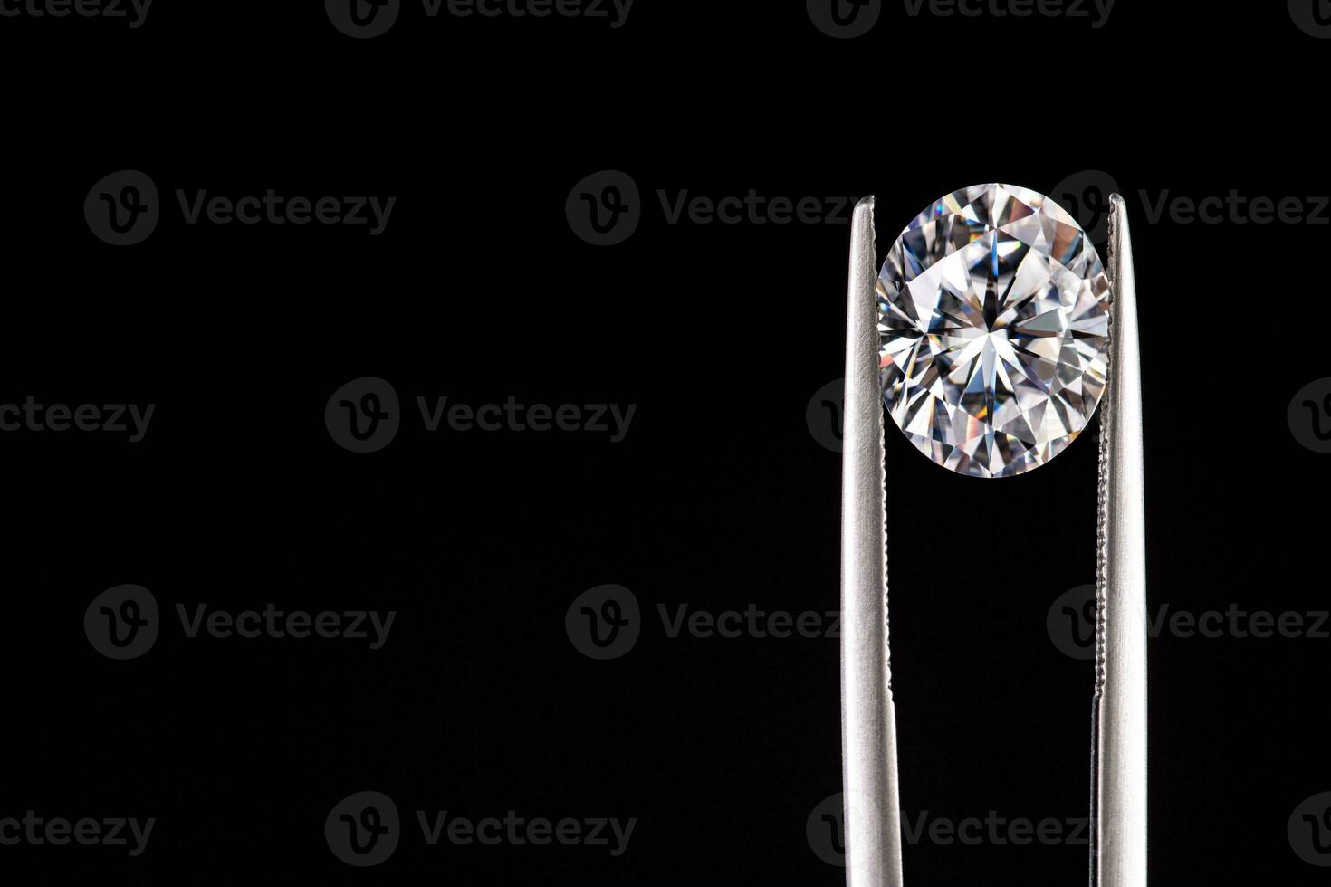 Diamond Gemstone in Jewelry Tweezers photo