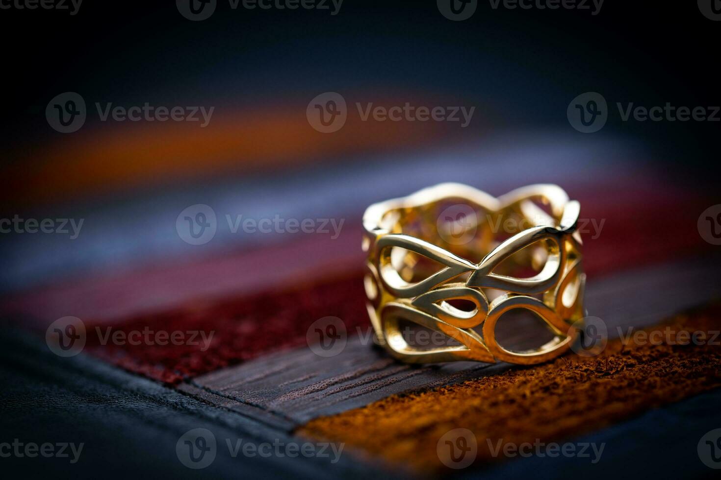 Luxury Yellow Gold Ring on Leather Background photo