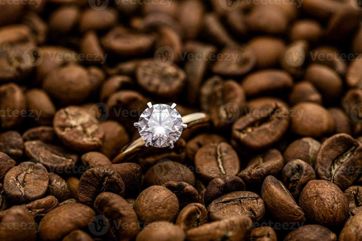 Engagement Diamond Ring on Coffee beans photo
