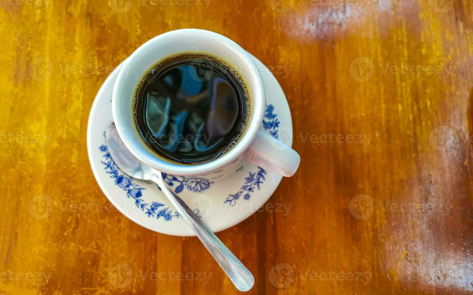 https://static.vecteezy.com/system/resources/previews/024/351/136/non_2x/blue-white-cup-pot-with-black-coffee-wooden-table-mexico-photo.jpg