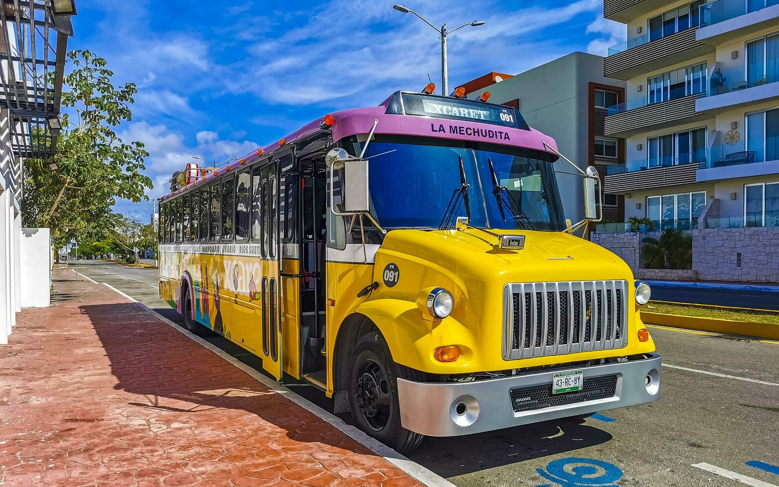 Playa del Carmen Quintana Roo Mexico 2023 Colorful pink yellow green Xcaret bus Playa del Carmen Mexico. photo