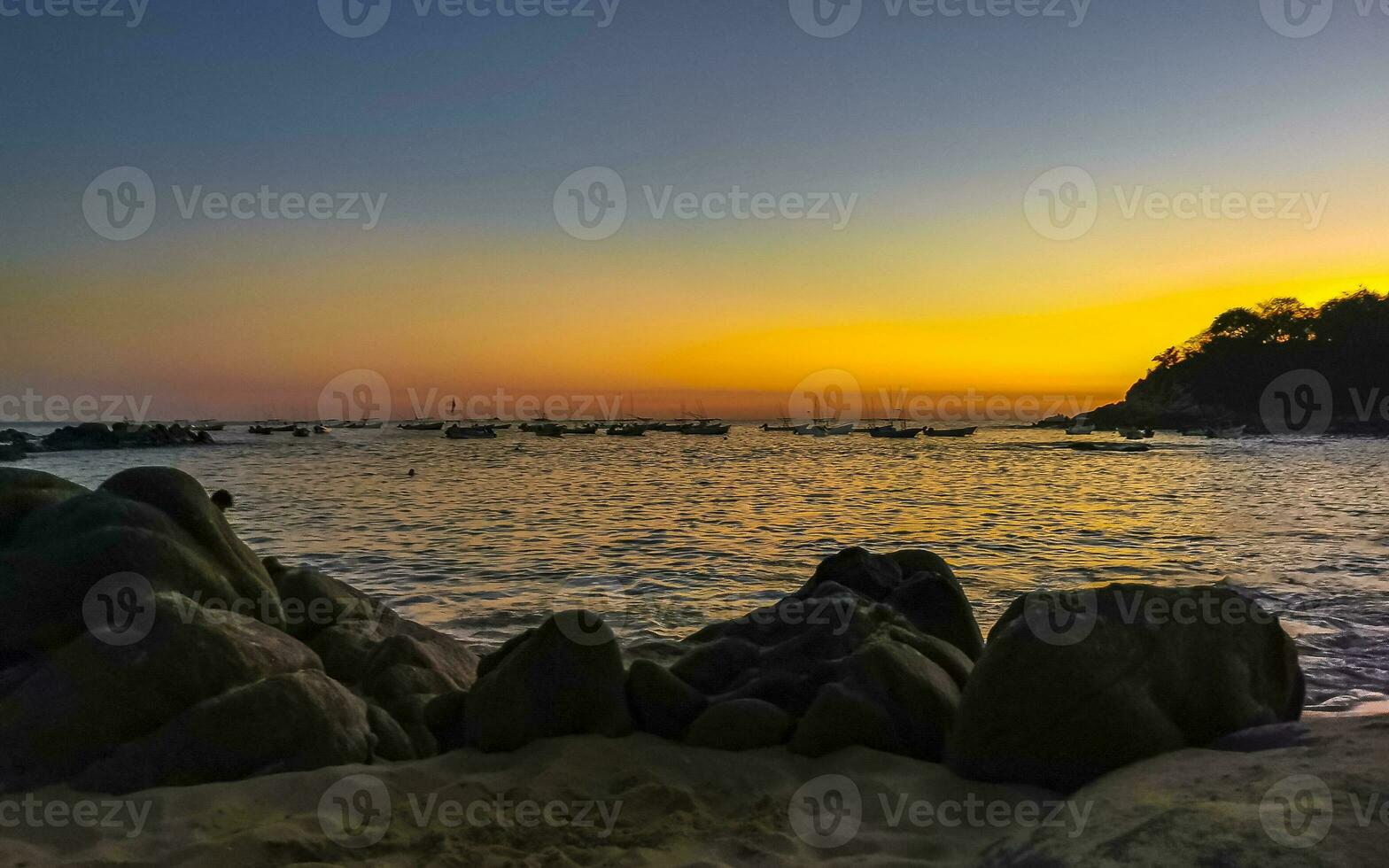 Colorful golden sunset big wave and beach Puerto Escondido Mexico. photo