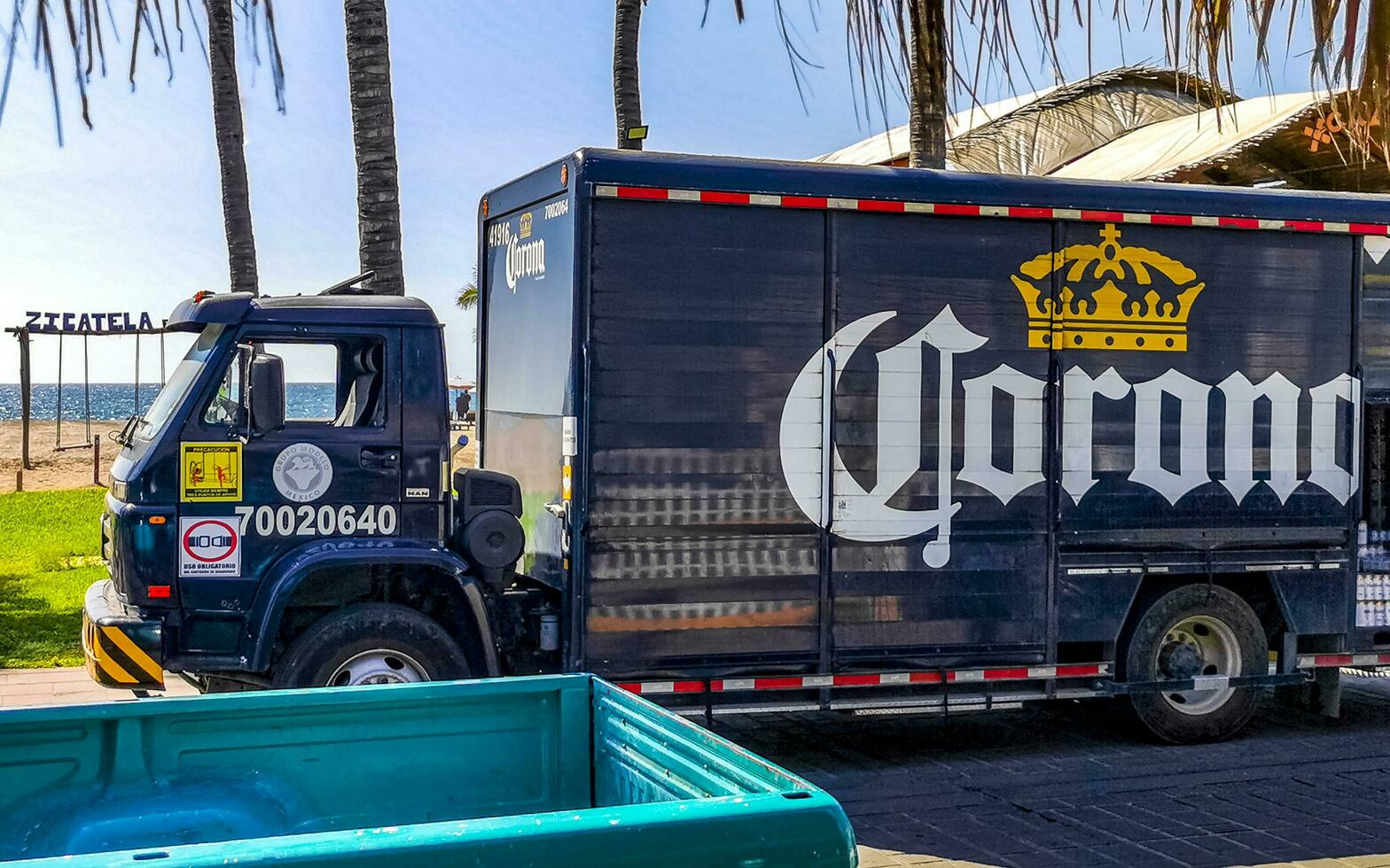 Puerto Escondido Oaxaca Mexico 2023 Mexican Corona beer trucks cargo transporter delivery cars in Mexico. photo