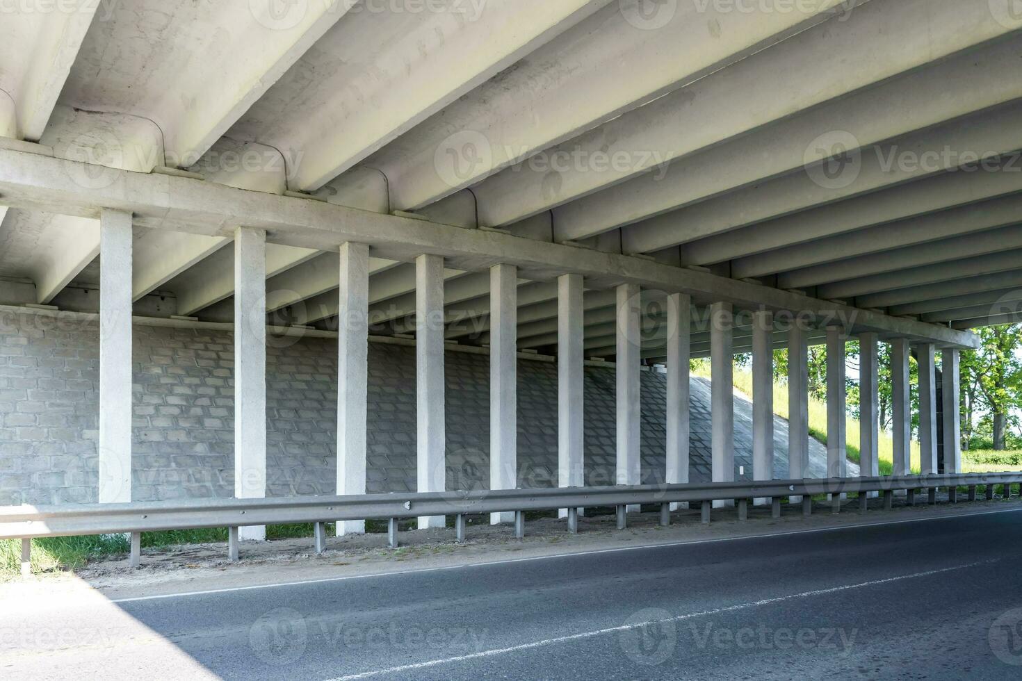 concrete columns like pillars of an automobile bridge photo