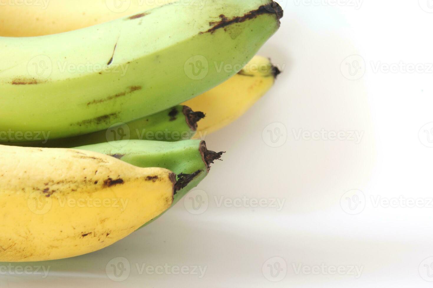 1 combed banana on a white background. photo