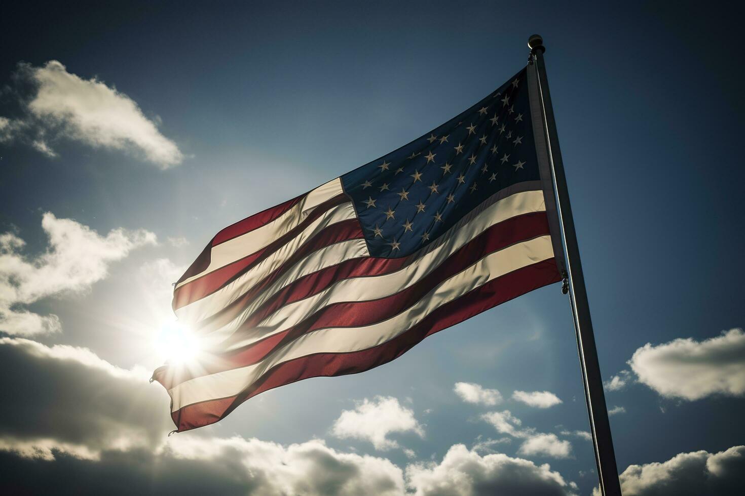 Backlit us national flag flying and waving in the wind over gray stormy cloudy sky, symbol of american patriotism, low angle, generate ai photo