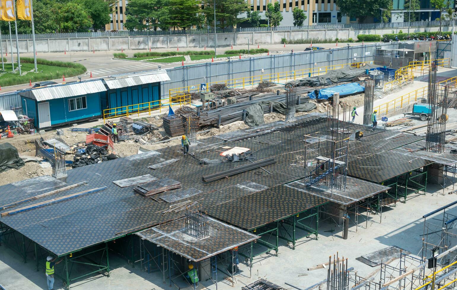 View of the construction site and red cranes for building modern residential area photo