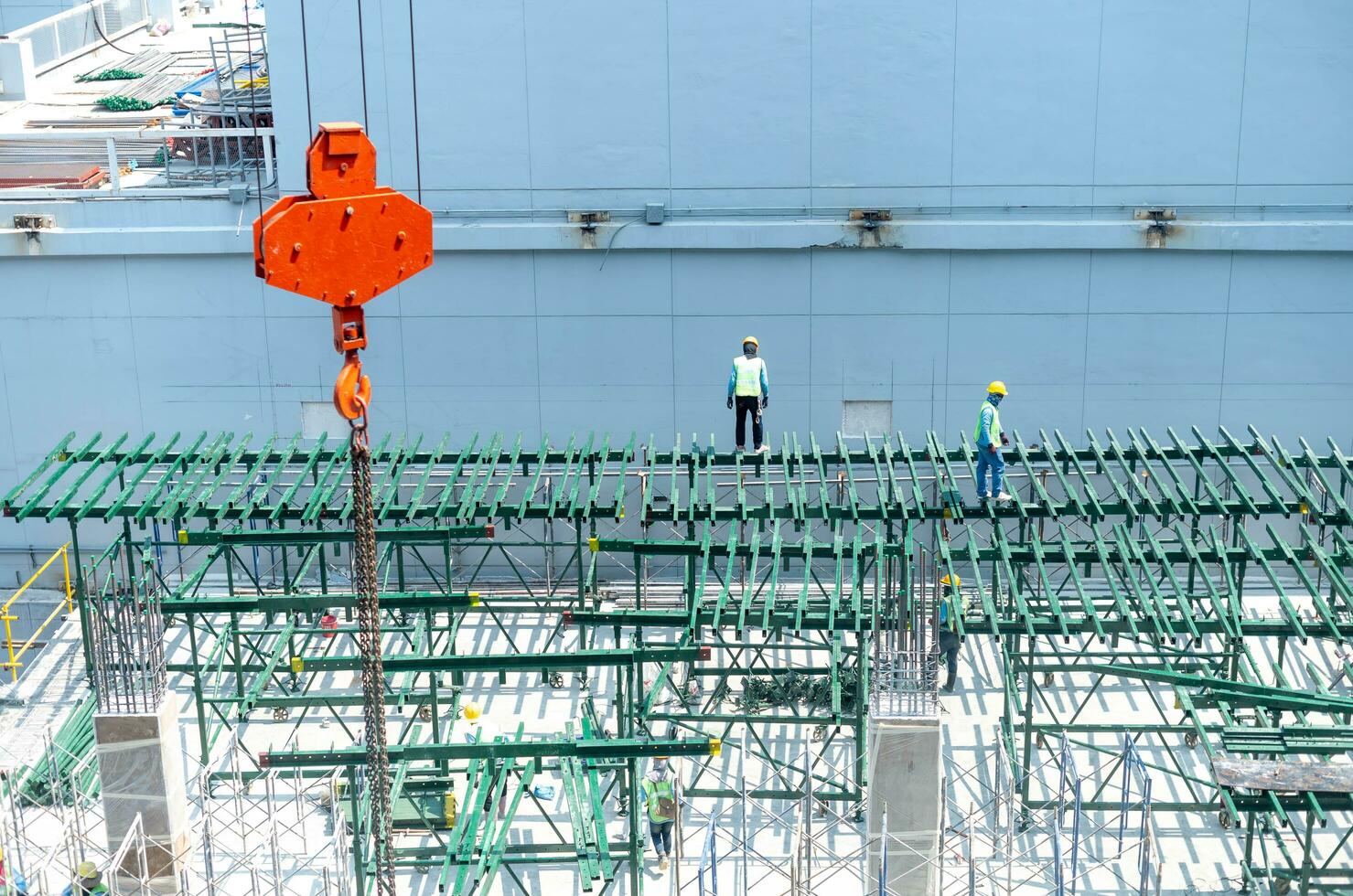 View of the construction site and red cranes for building modern residential area photo