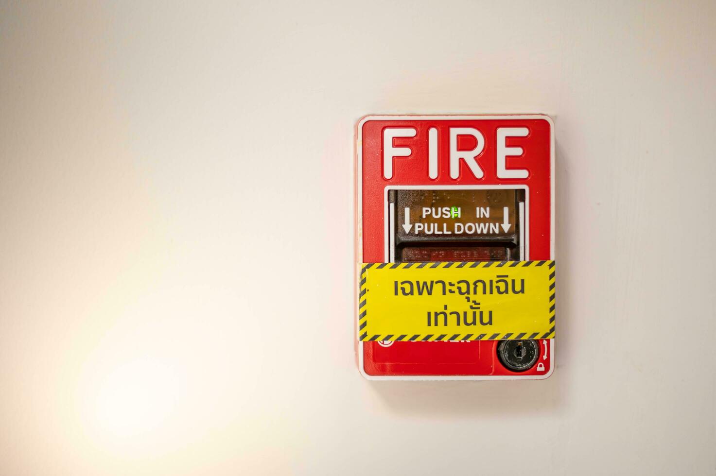 Fire alarm on the wall in subway in Bangkok,  At the Bangkok subway fire warning equipment for emergency. photo