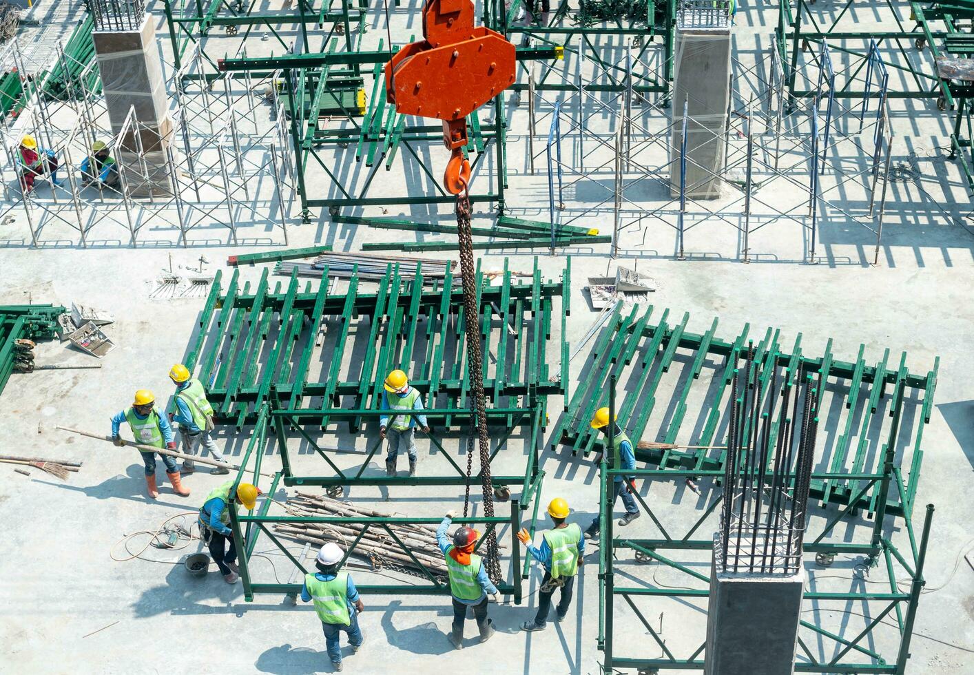 View of the construction site and red cranes for building modern residential area photo