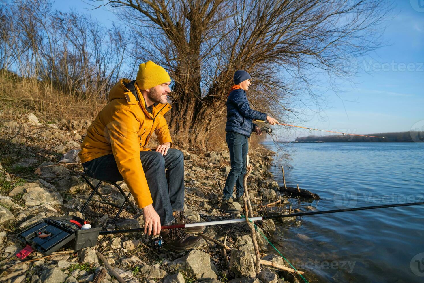 Father and son fishing together photo