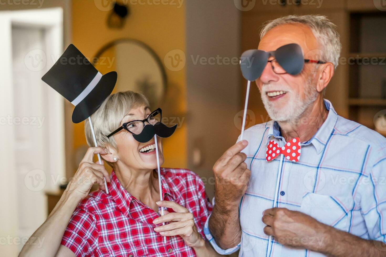 Senior couple partying indoors photo