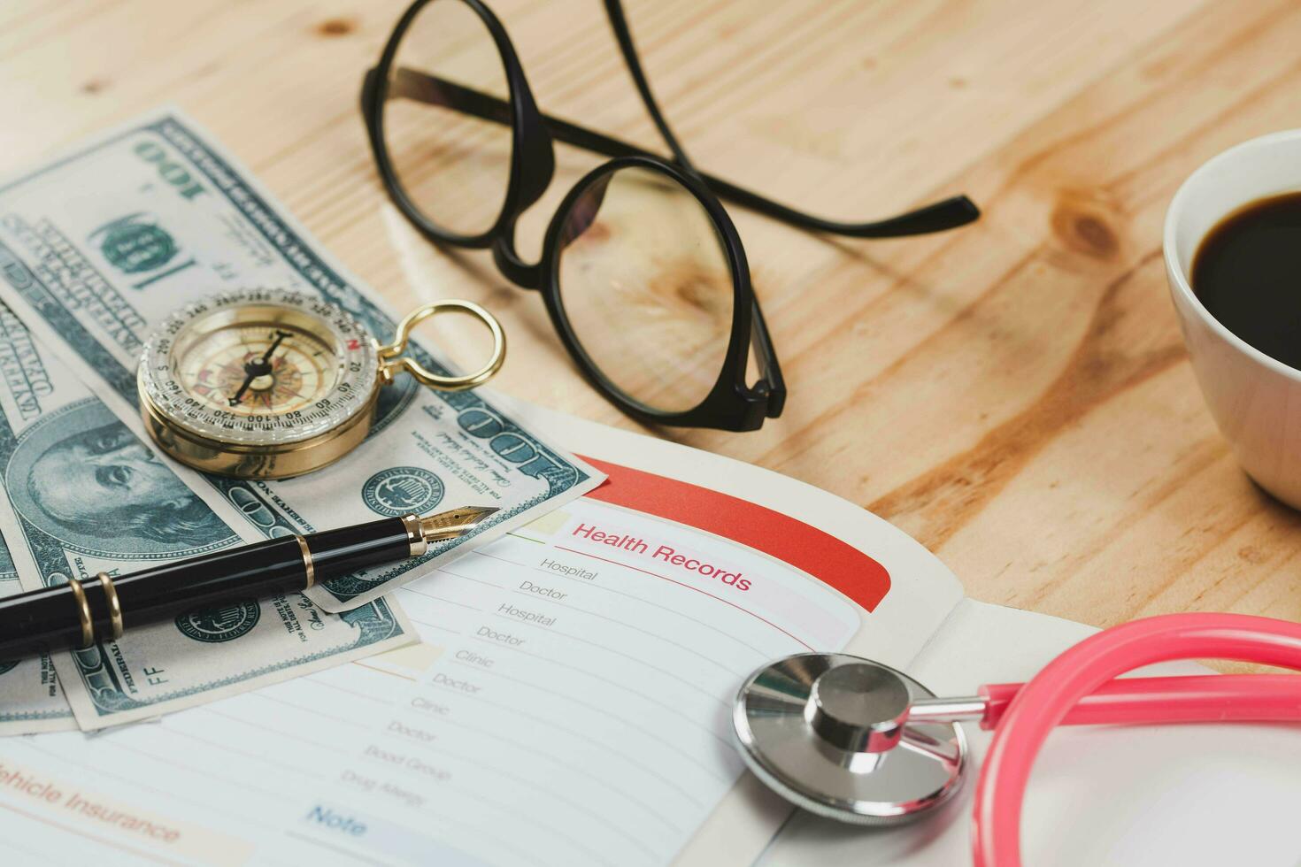 Health records in book note with fountain pen wooden background. photo