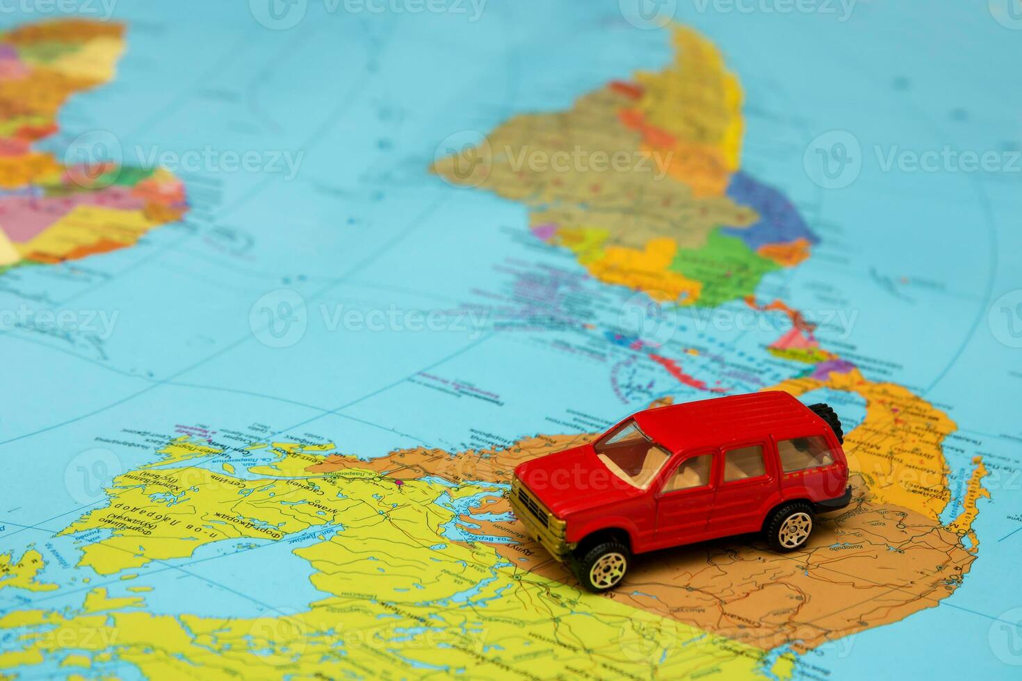 red toy car on world map in north america photo