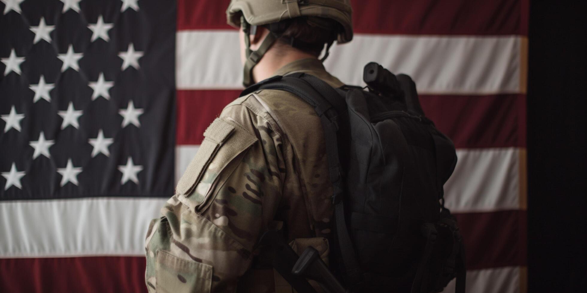 Soilder with an american flag on his back photo