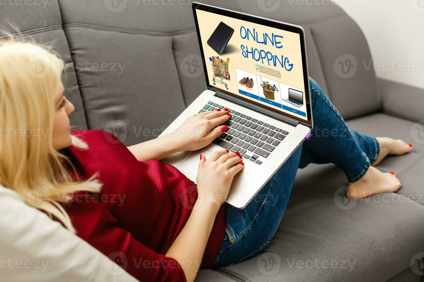 shopping, technology and internet concept young girl shopping with laptop computer on a fictional shop photo