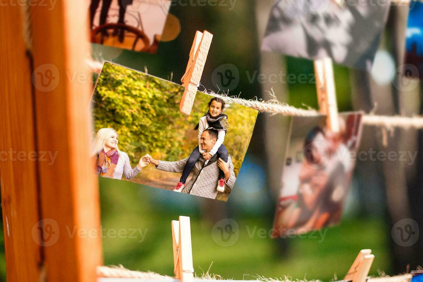 autumn photos are hanging on a clothespin