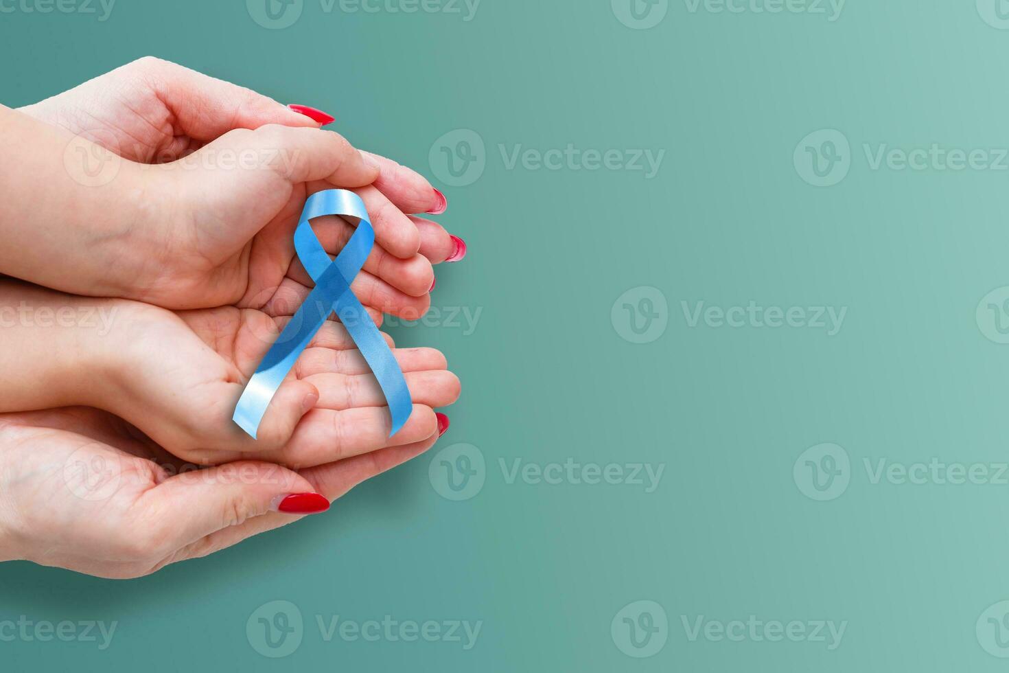 blue ribbon representing an annual event during the month of November to raise awareness of men's health issues and prostate cancer with copy space photo