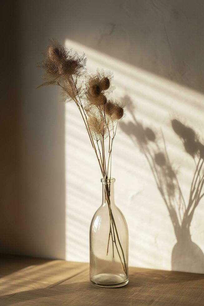 Dried meadow grass bouquet in clear glass bottle aesthetic sun light shadows on neutral wall, minimalist floral interior design , generate ai photo