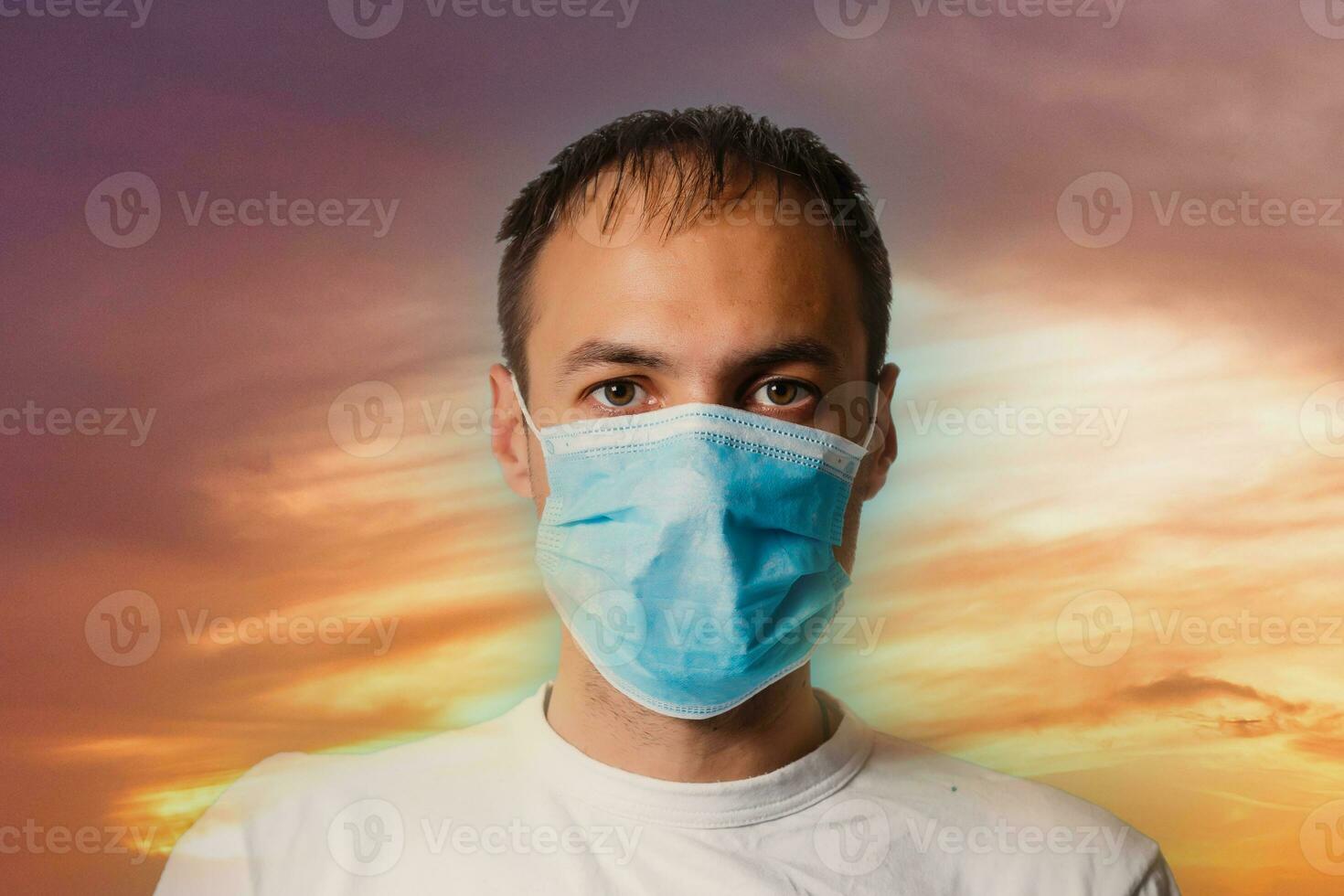 Corona virus covid-19  Closeup with the face of a young doctor wearing medical or surgical mask photo