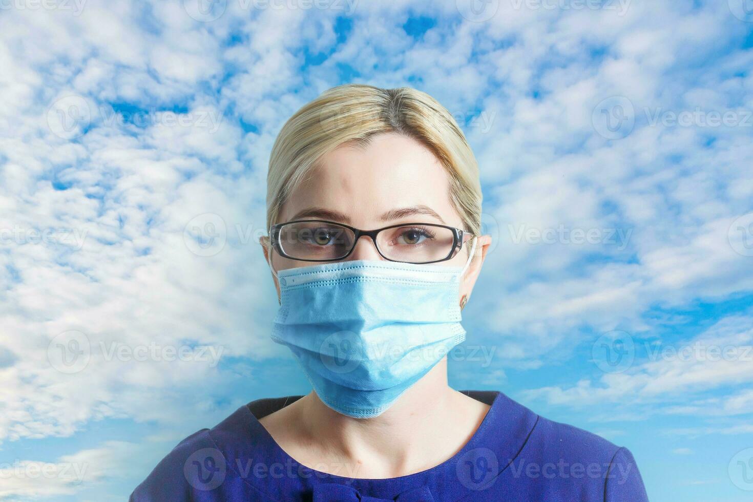 Corona virus covid-19  Closeup with the face of a young doctor wearing medical or surgical mask photo