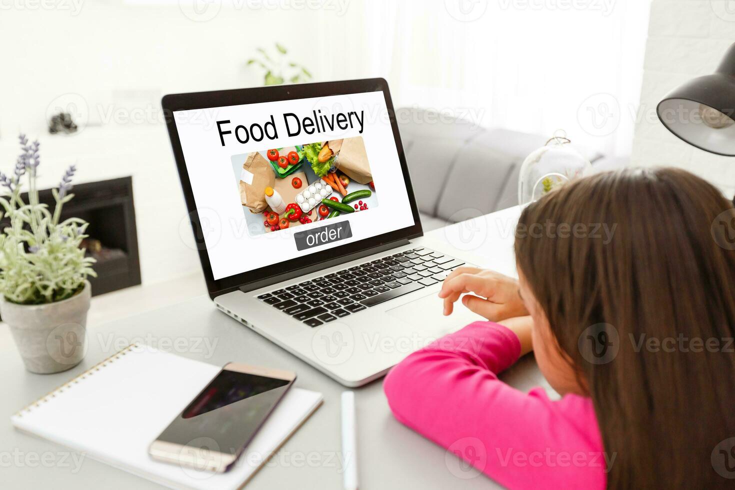 Food take away website in a laptop screen. Lunch at the office. photo