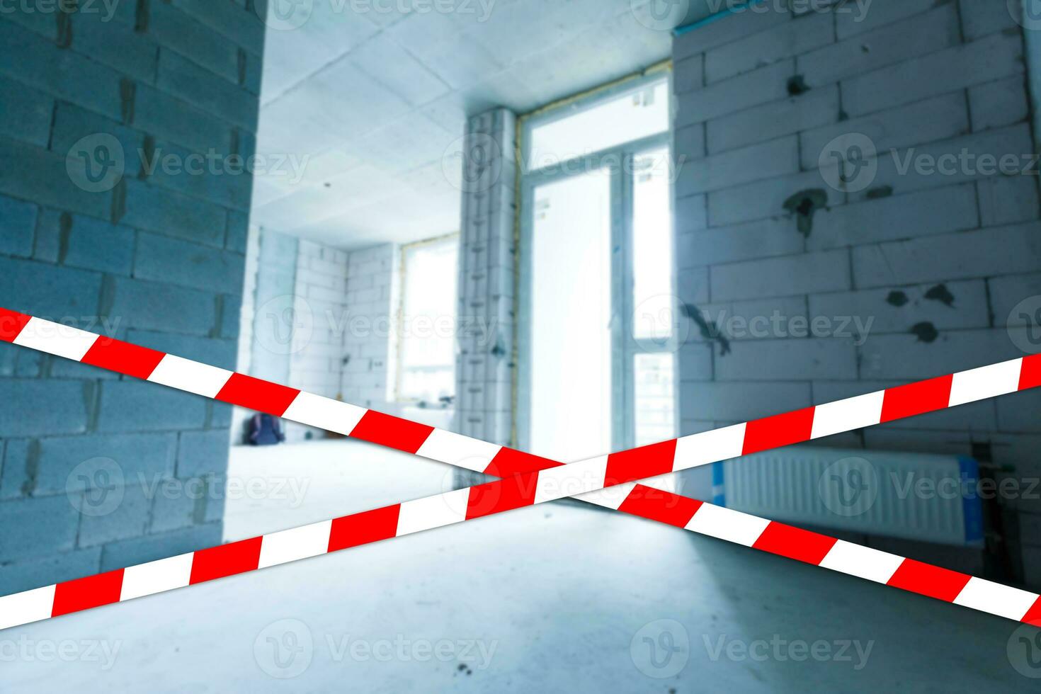 red and white safety tape at the construction site photo