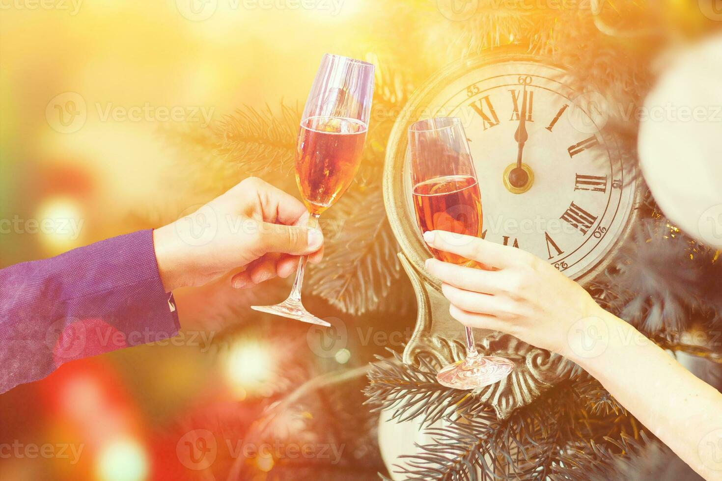 Two glasses of champagne with lights in the background. christmas background photo