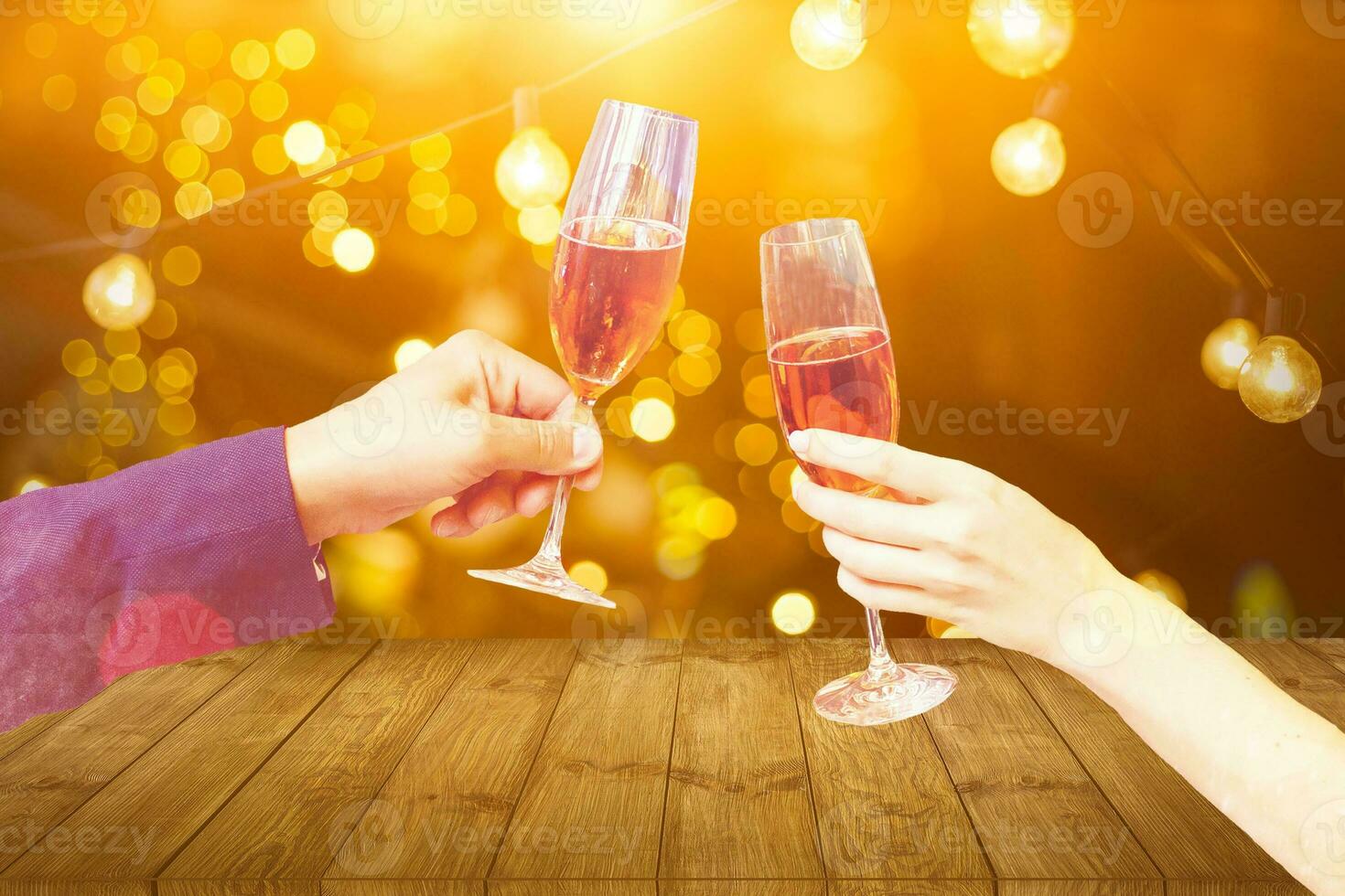 Two glasses of champagne with lights in the background. christmas background photo