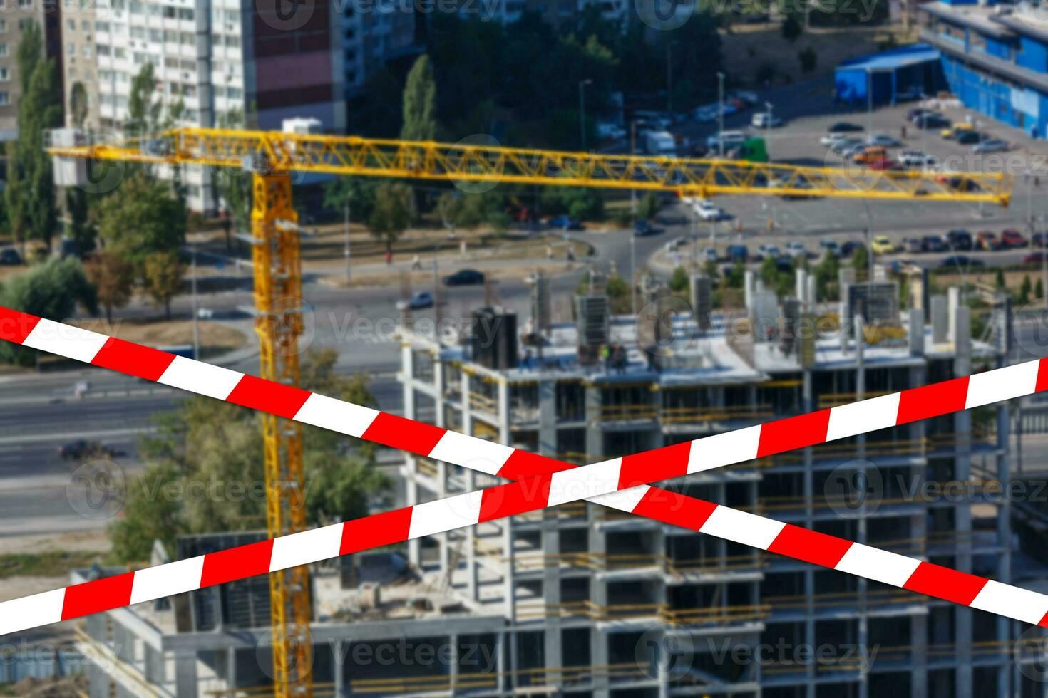 red and white safety tape at the construction site photo