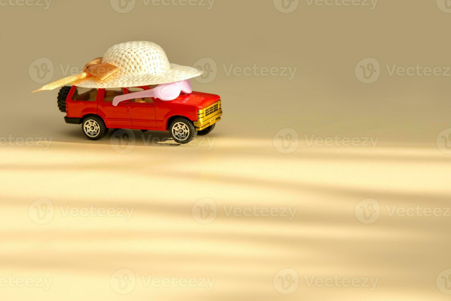 wearing glasses and a straw hat rides into the sunlight, vacation content photo