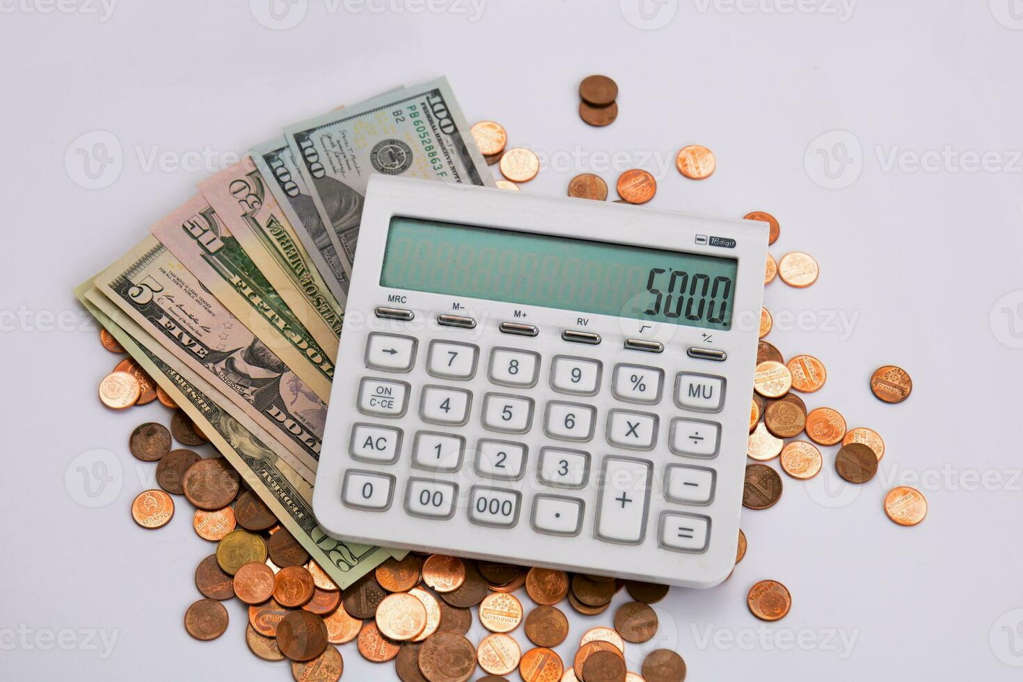 money with a calculator on a light background photo