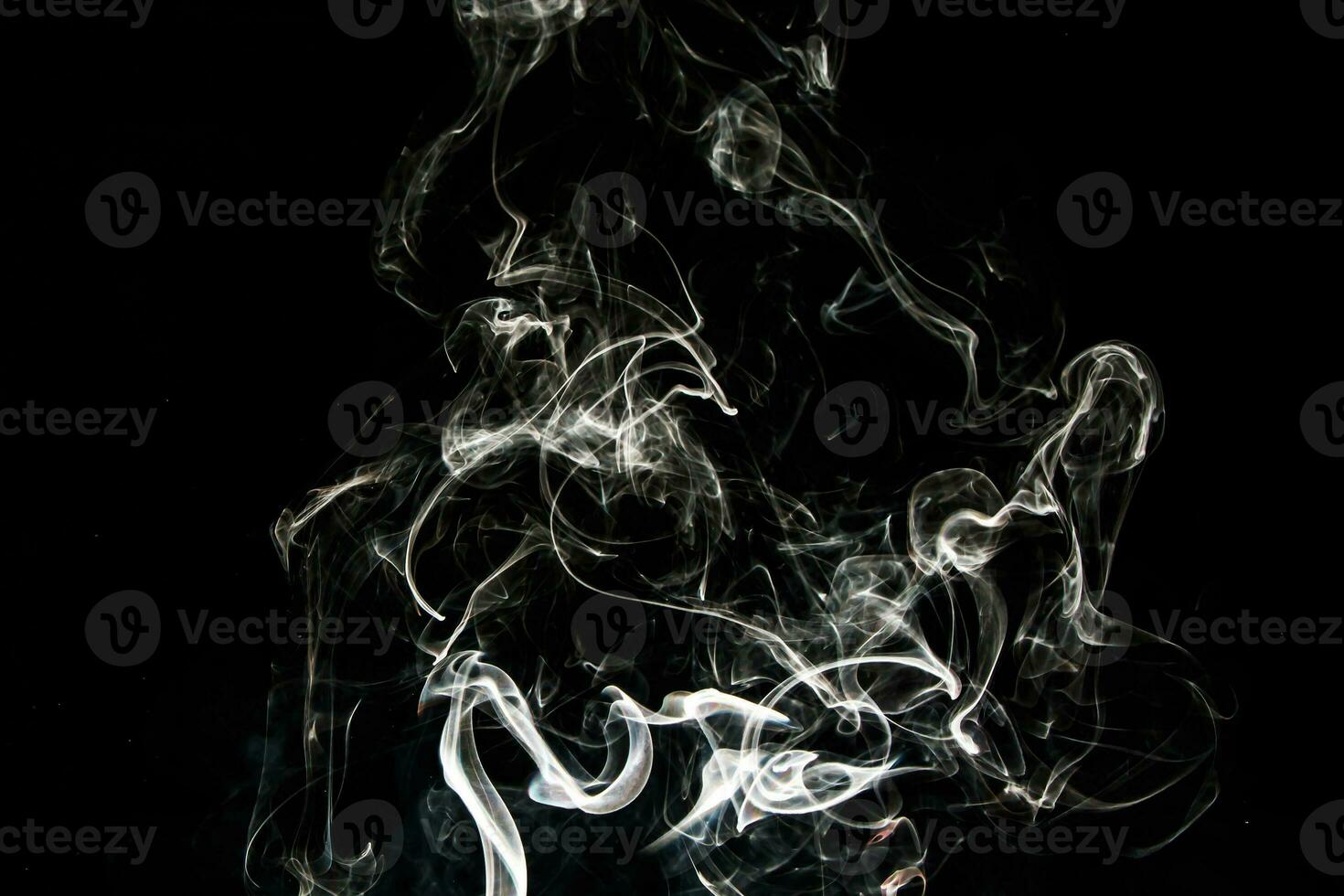 Smoke effect texture. Isolated background. Black and dark backdrop. Smokey fire and mistic effect. photo