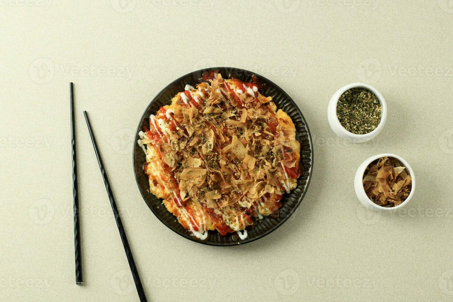 Okonomiyaki, Japanese Osaka Seafood Pancake with Dried Bonito photo