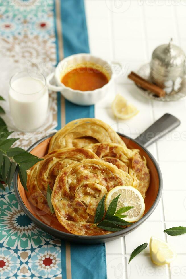 Roti Parata or Roti Canai with Lamb Curry Sauce photo