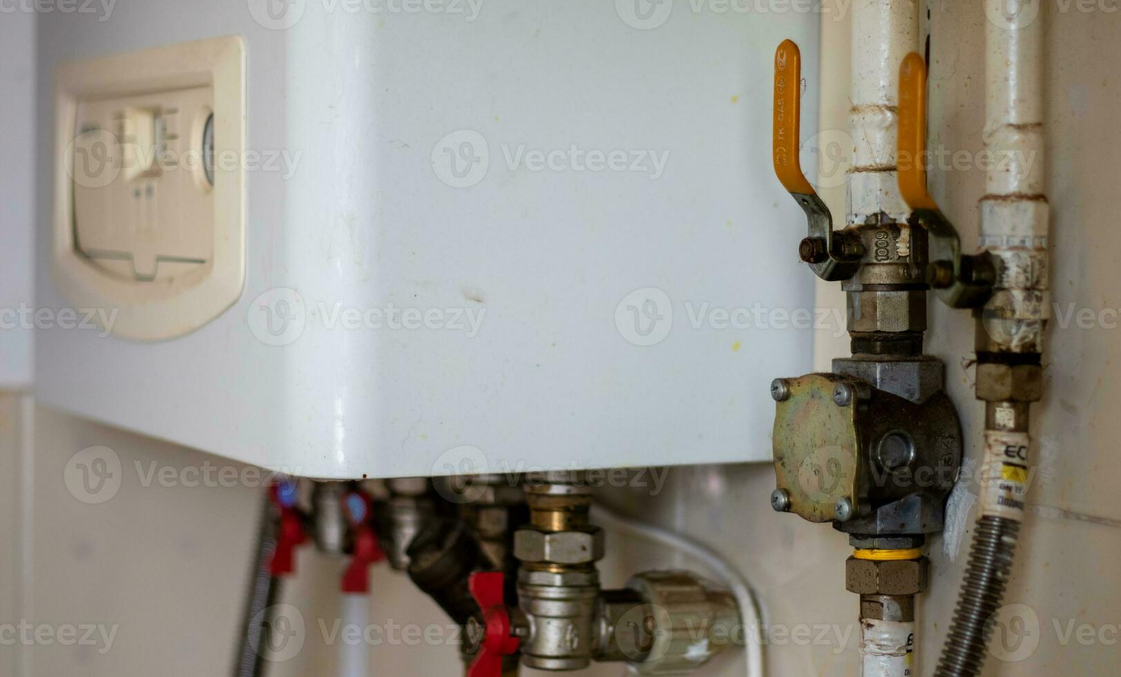 Heating gas boiler. Symbolic image of the heating season at home. The dial on a domestic combi boiler. Hot water and heating. Condensing boiler and boiler accessories. photo