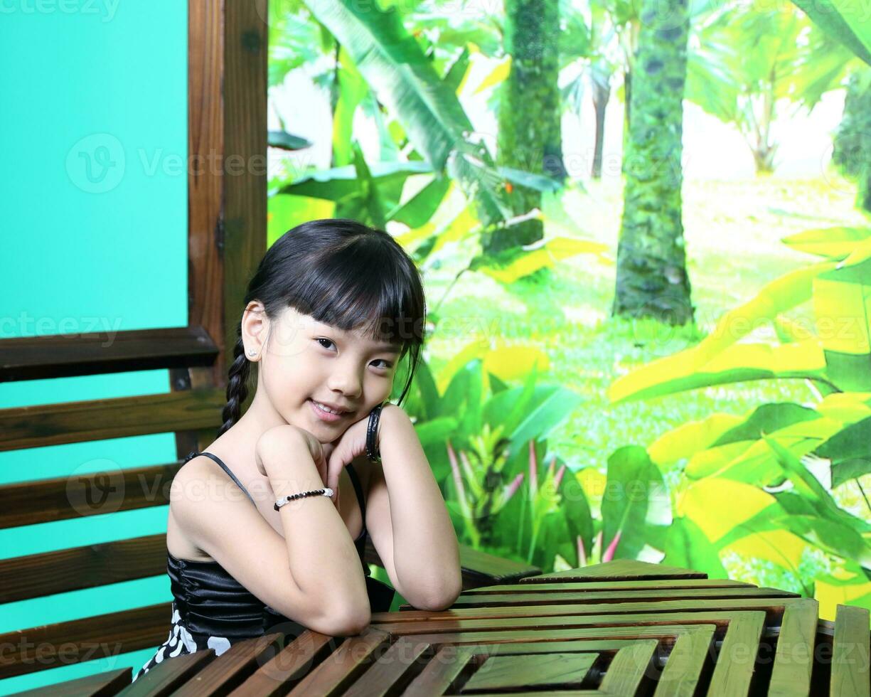 South East Asian young father mother daughter  parent girl child activity indoor photo