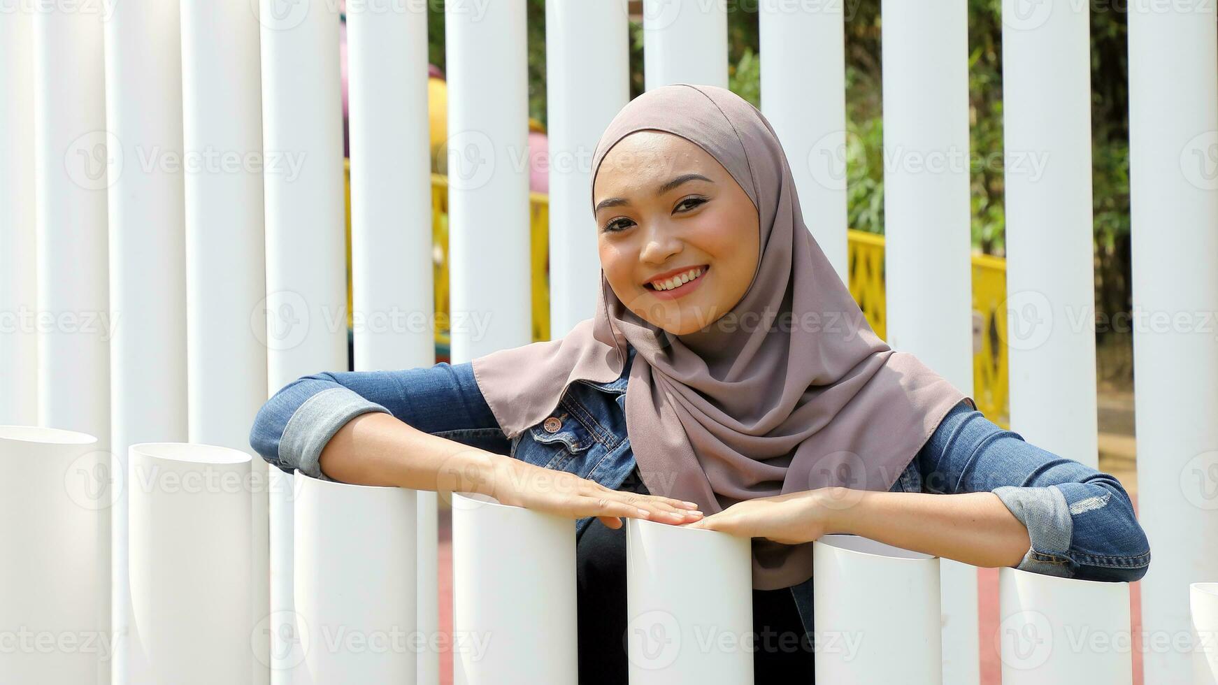 Young Asian Malay man woman outdoor green park walk talk discuss mingle photo