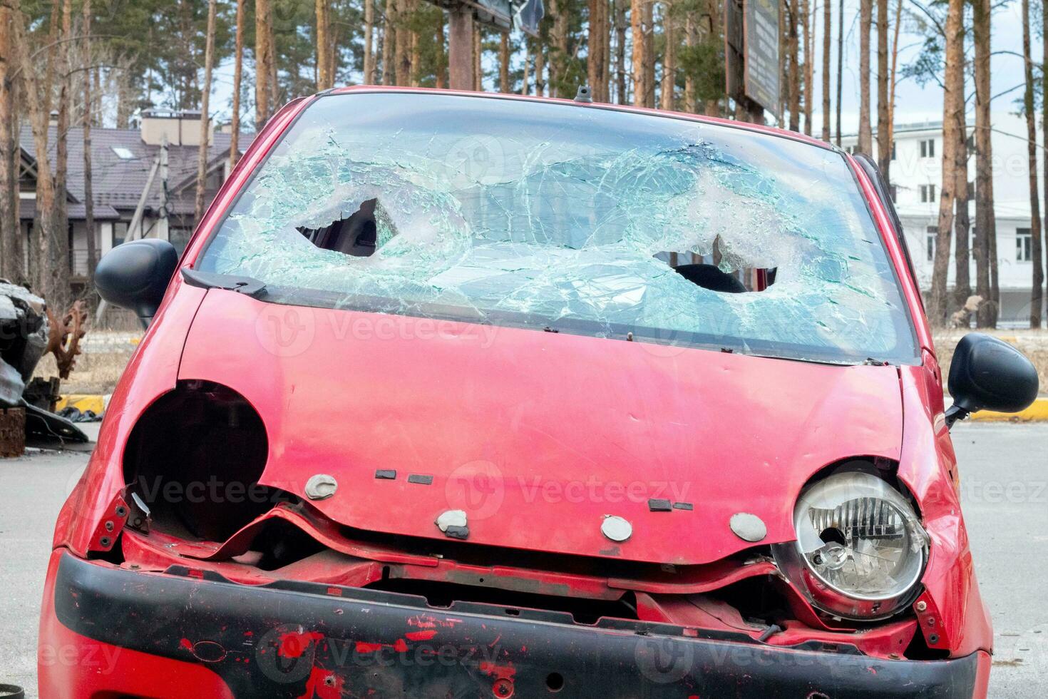 Broken windshield from a car accident. The windshield of the car was broken. Broken windproof car accident. Car accident. A window repair company will come to you to replace the broken glass. photo