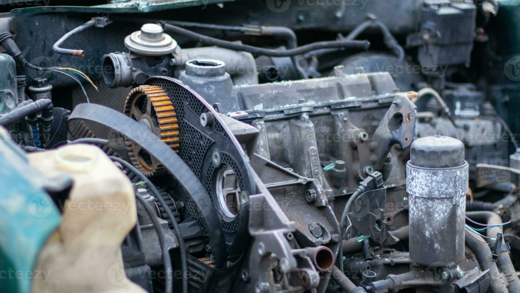 Broken crumpled car after a severe accident with a skewed body, after a powerful impact on the side of the road. Traffic accident on the street, damaged car after a collision in the city. photo