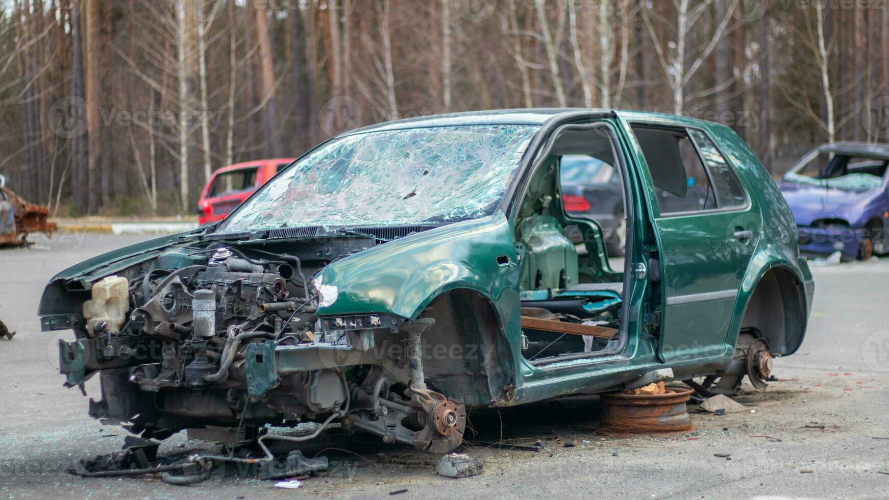 Broken crumpled car after a severe accident with a skewed body, after a powerful impact on the side of the road. Traffic accident on the street, damaged car after a collision in the city. photo