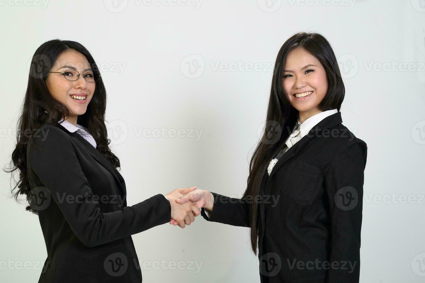 One young Asian Malaysian business office woman holding blank copy text space sign board on white background photo